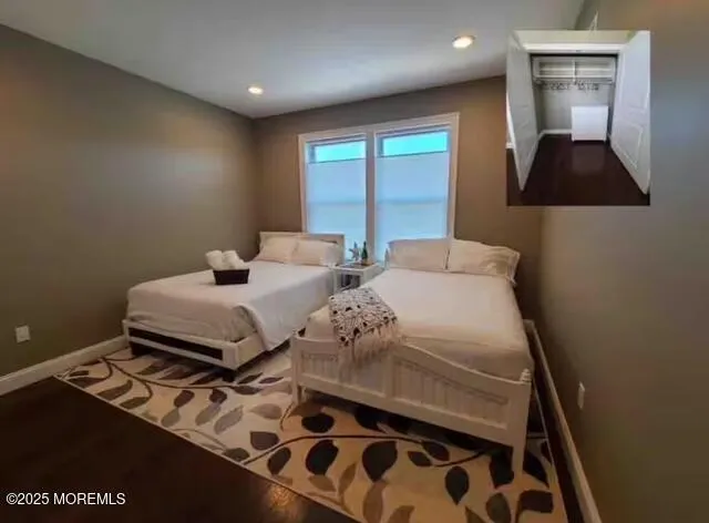 a bedroom with furniture and a window