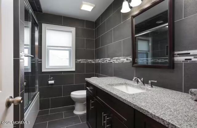 431 Hiering Avenue Seaside Heights, NJ 08751 - Photo 23 of 32 a bathroom with a granite countertop sink a toilet and a mirror
