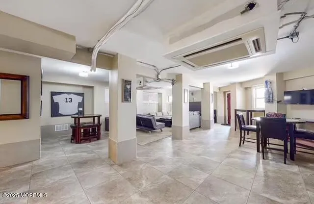 a lobby with furniture and a view of living room