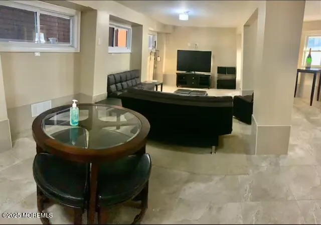 a dining room with a table and chairs