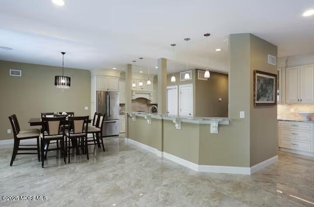 431 Hiering Avenue Seaside Heights, NJ 08751 - Photo 8 of 32 a view of a kitchen and dining room