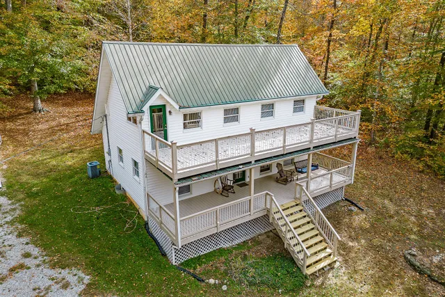 an aerial view of a house with roof deck