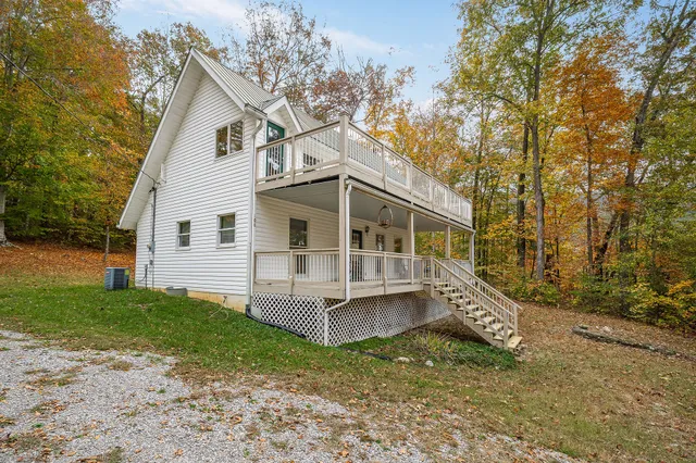 a view of house with a yard