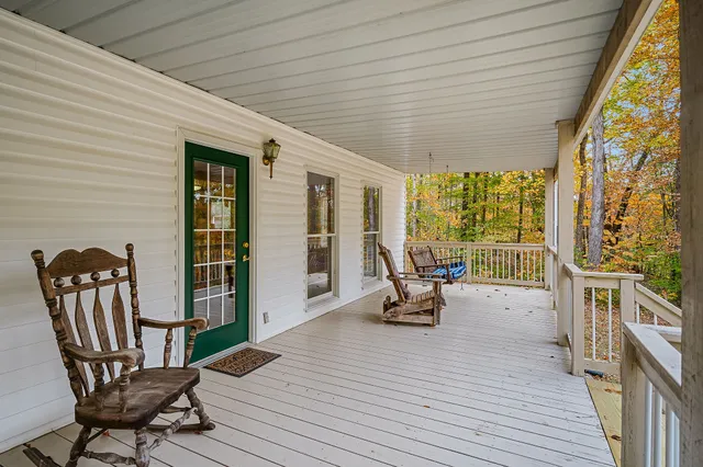 a view of two chairs in the balcony