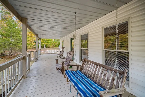 a view of a yard with wooden fence