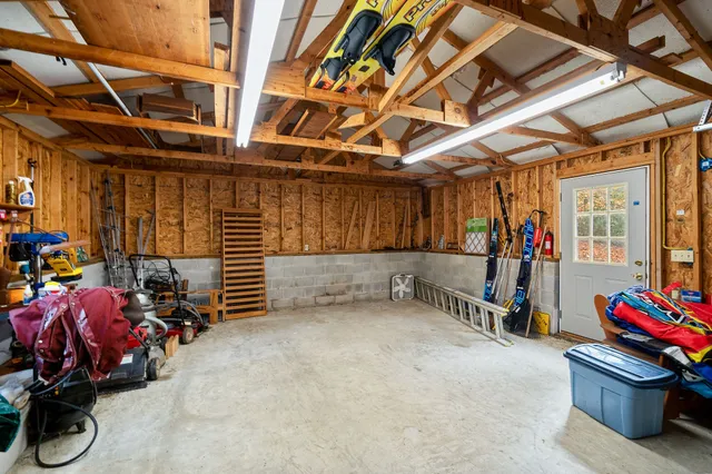 a view of a hallway with wooden floor and closet area