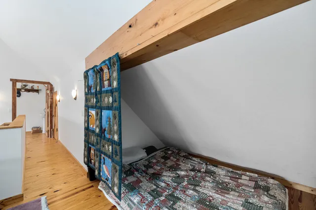 a living room with furniture a rug and a window