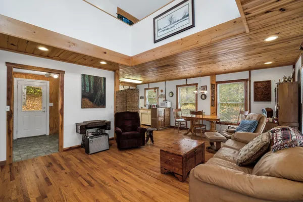 a living room with furniture or stairs and a wooden floor