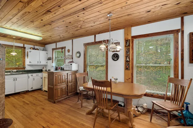 a kitchen that has a sink a stove and a window