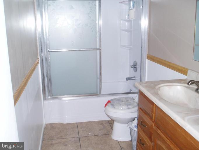 620 Banyan Road Edgewood, MD 21040 - Photo 6 of 15 a bathroom with a sink a toilet and shower