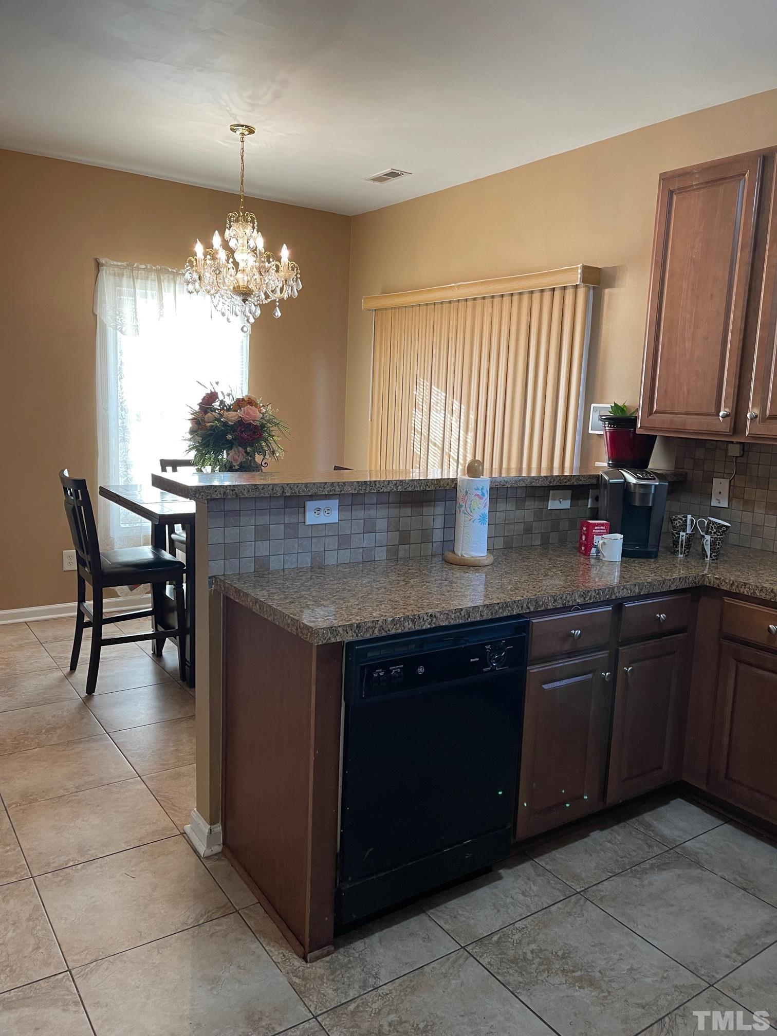 3516 Rendition Street Raleigh, NC 27610 - Photo 11 of 24 a kitchen with a counter space a sink and cabinets