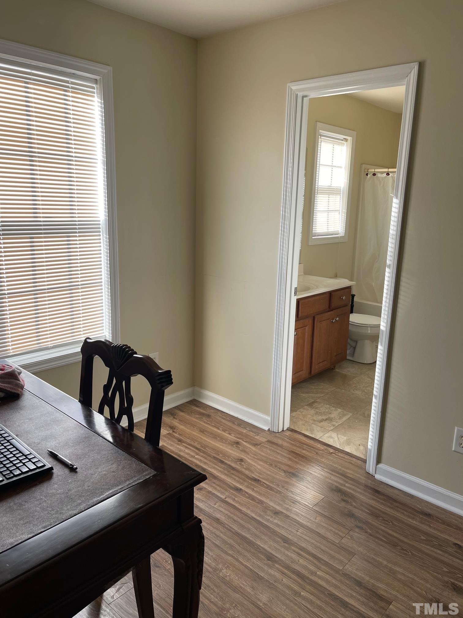 3516 Rendition Street Raleigh, NC 27610 - Photo 13 of 24 a view of a room that has a couch and a table in it