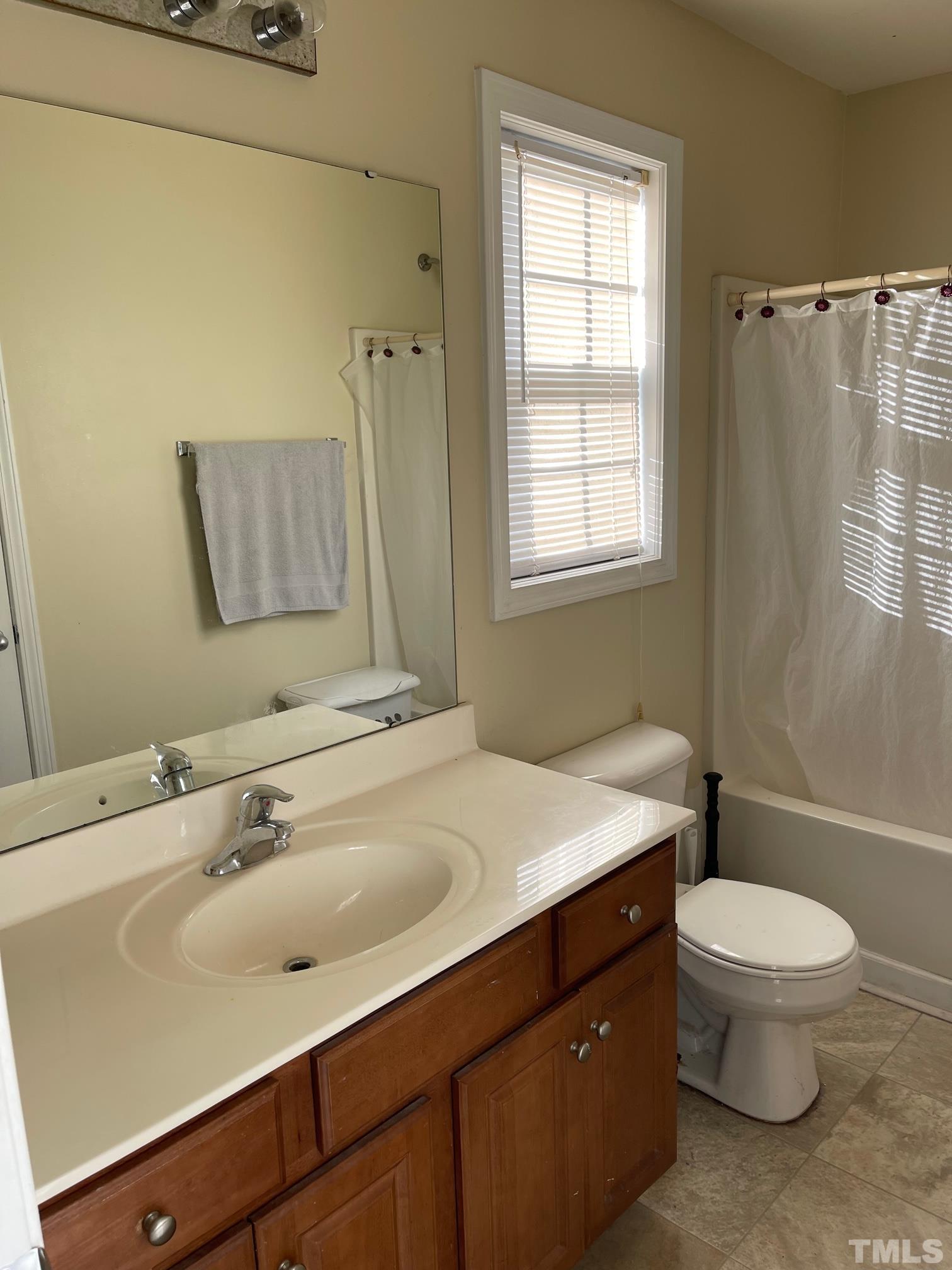 3516 Rendition Street Raleigh, NC 27610 - Photo 14 of 24 a bathroom with a sink toilet and shower