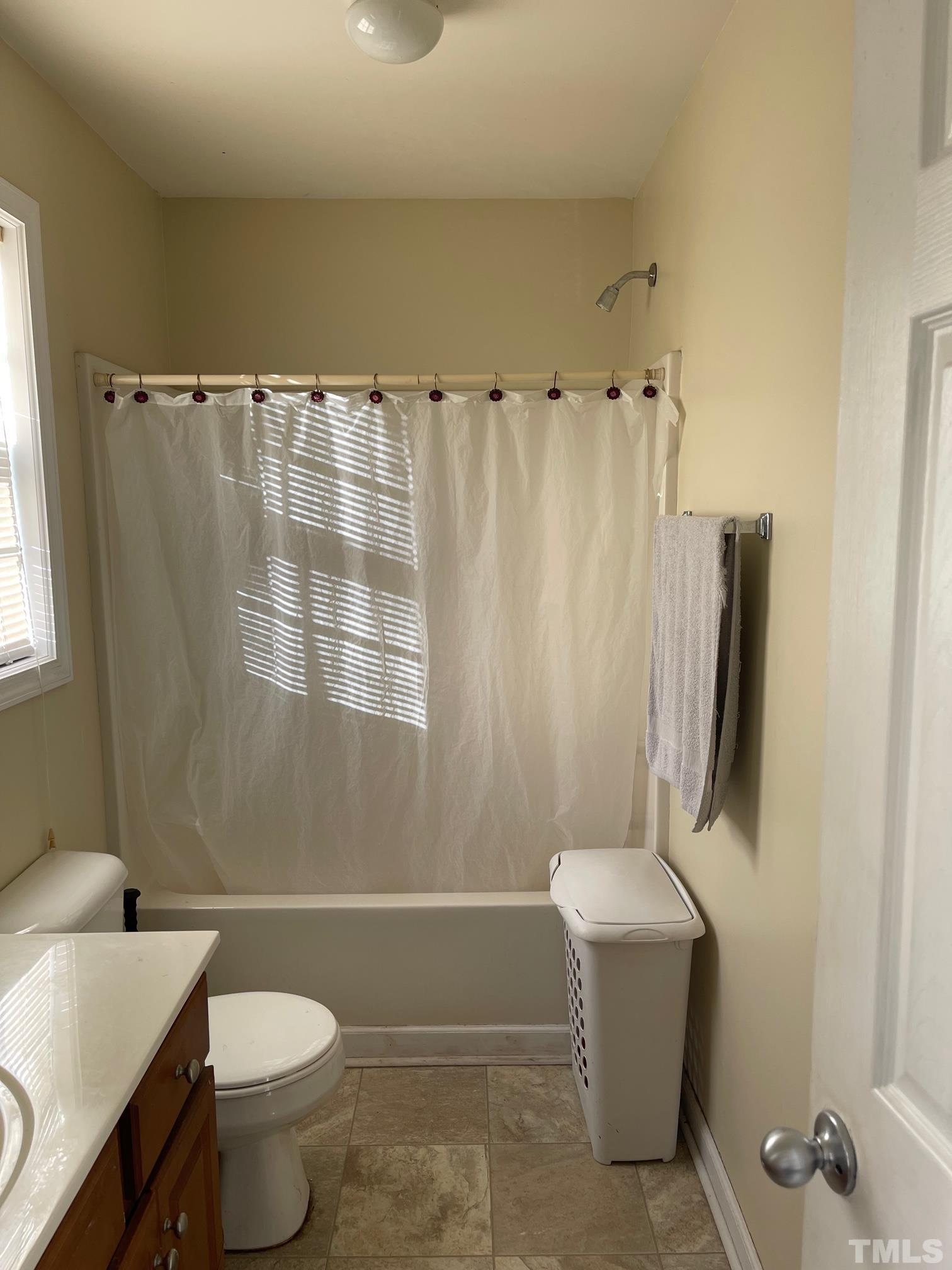 3516 Rendition Street Raleigh, NC 27610 - Photo 15 of 24 a bathroom with a sink toilet and shower