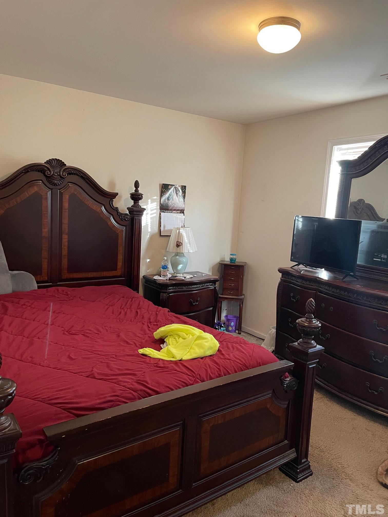 3516 Rendition Street Raleigh, NC 27610 - Photo 18 of 24 a bedroom with a bed and dresser