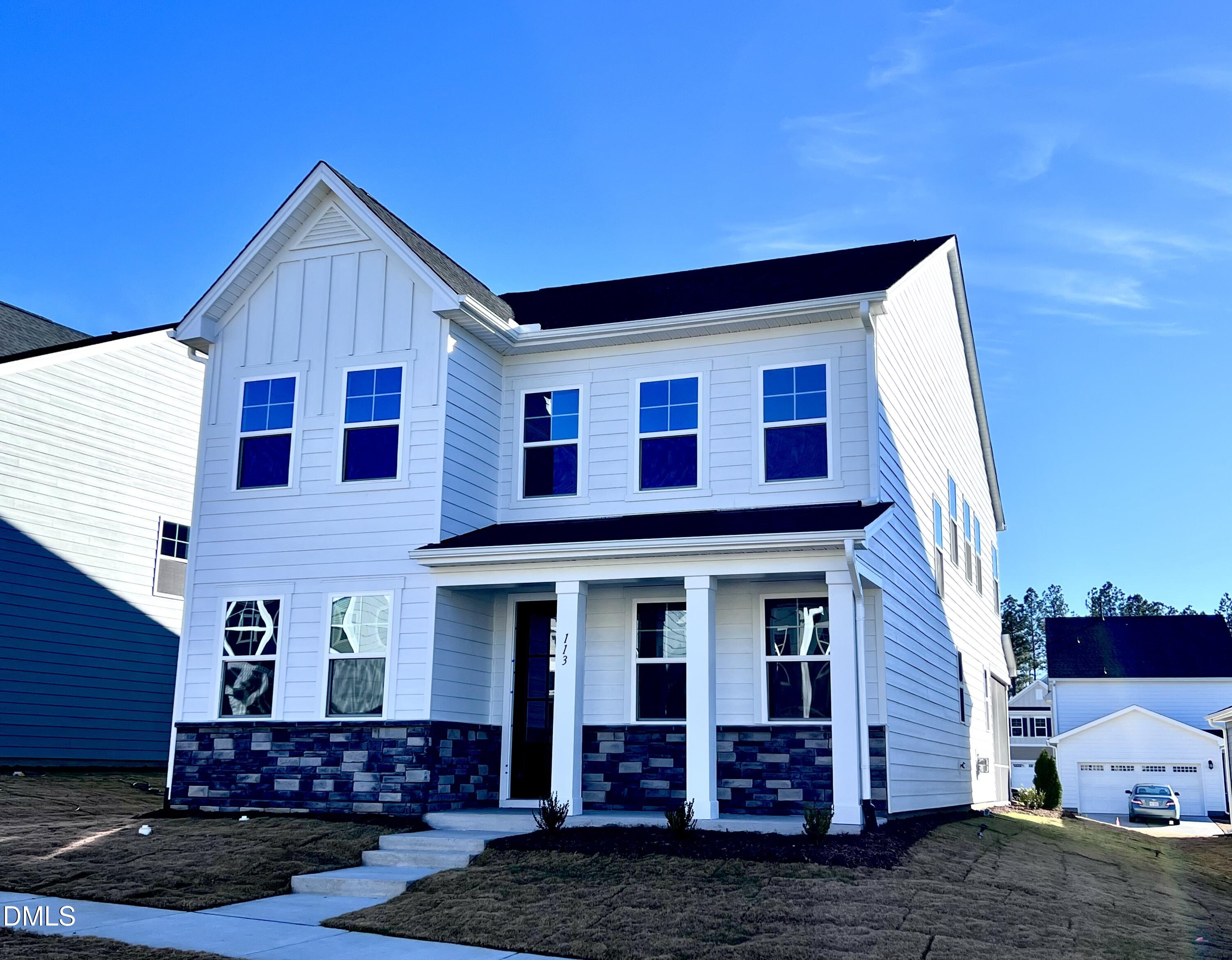 a view of a house with wooden fence