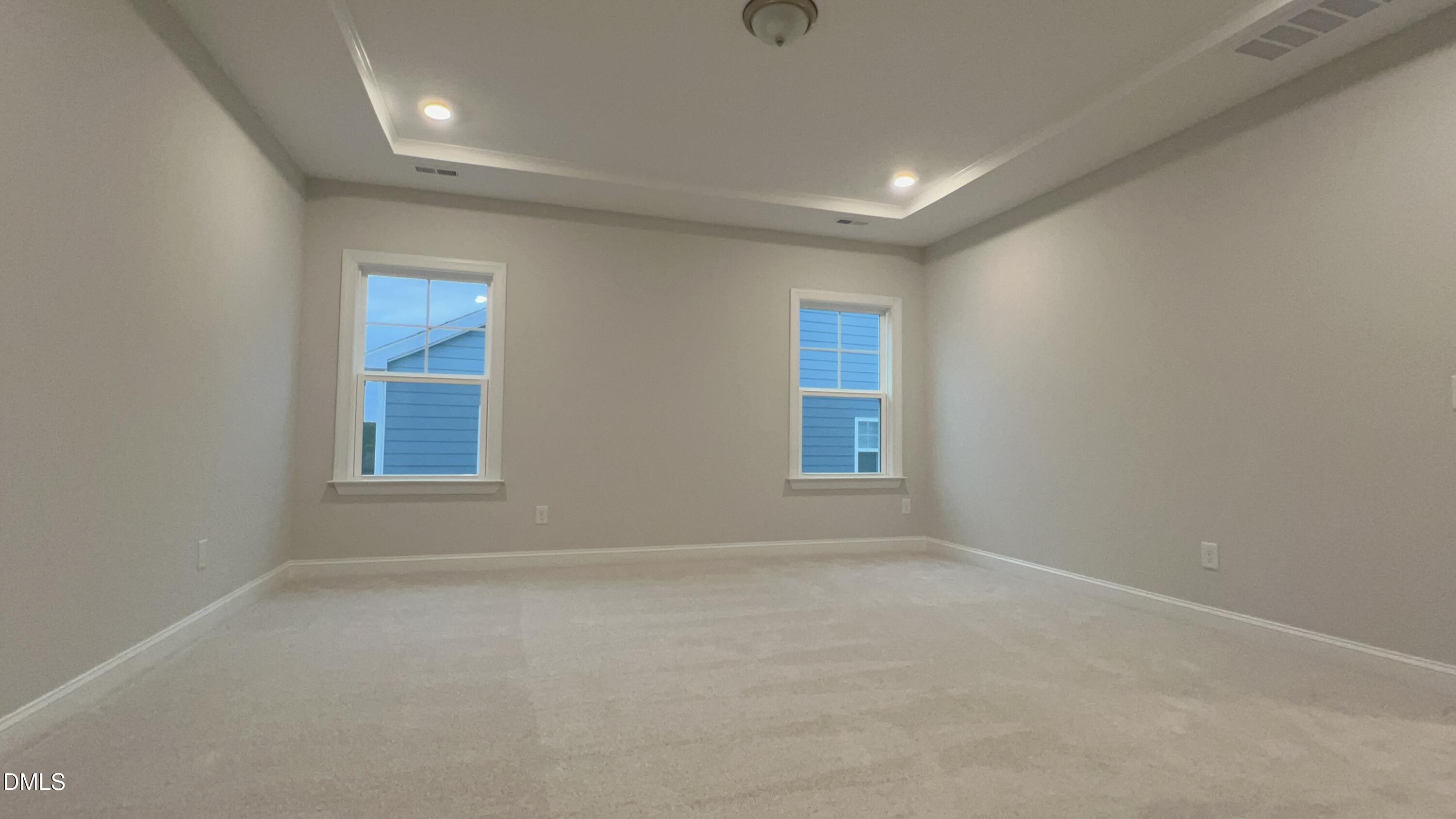 113 Corapeake Way Holly Springs, NC 27539 - Photo 12 of 20 an empty room with windows