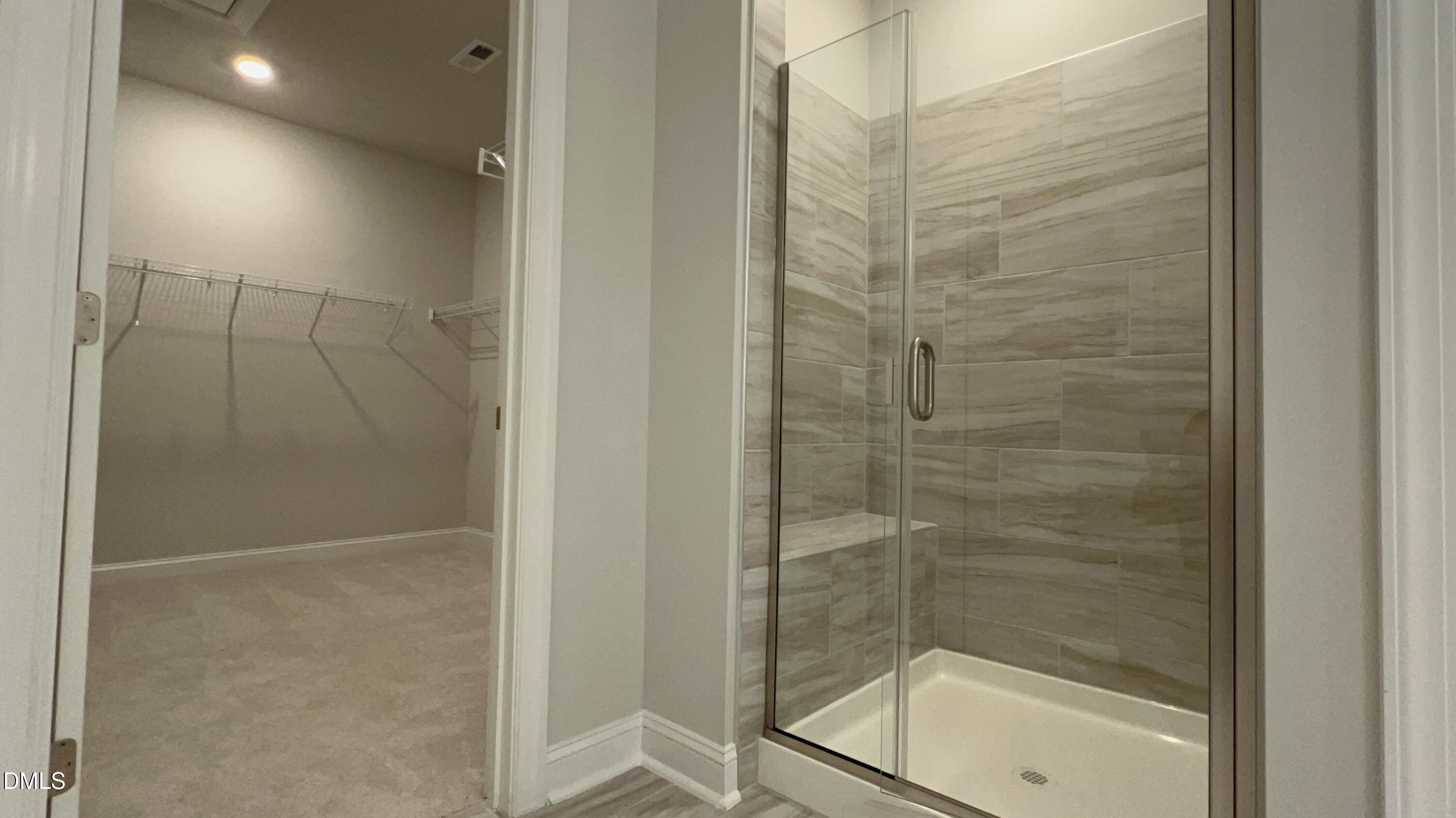 113 Corapeake Way Holly Springs, NC 27539 - Photo 13 of 20 a bathroom with a shower