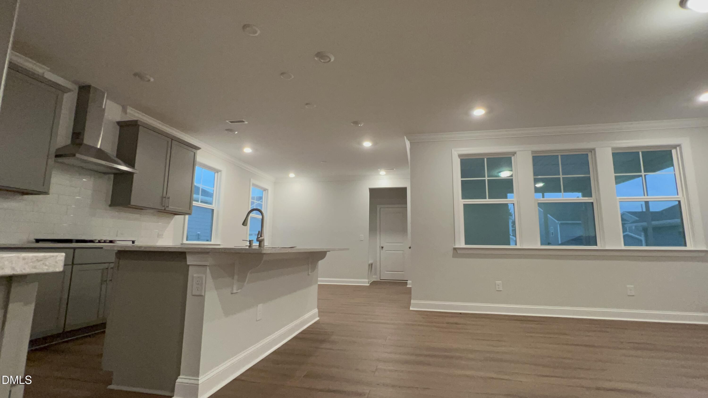 113 Corapeake Way Holly Springs, NC 27539 - Photo 6 of 20 a view of a kitchen with stainless steel appliances granite countertop a sink and cabinets