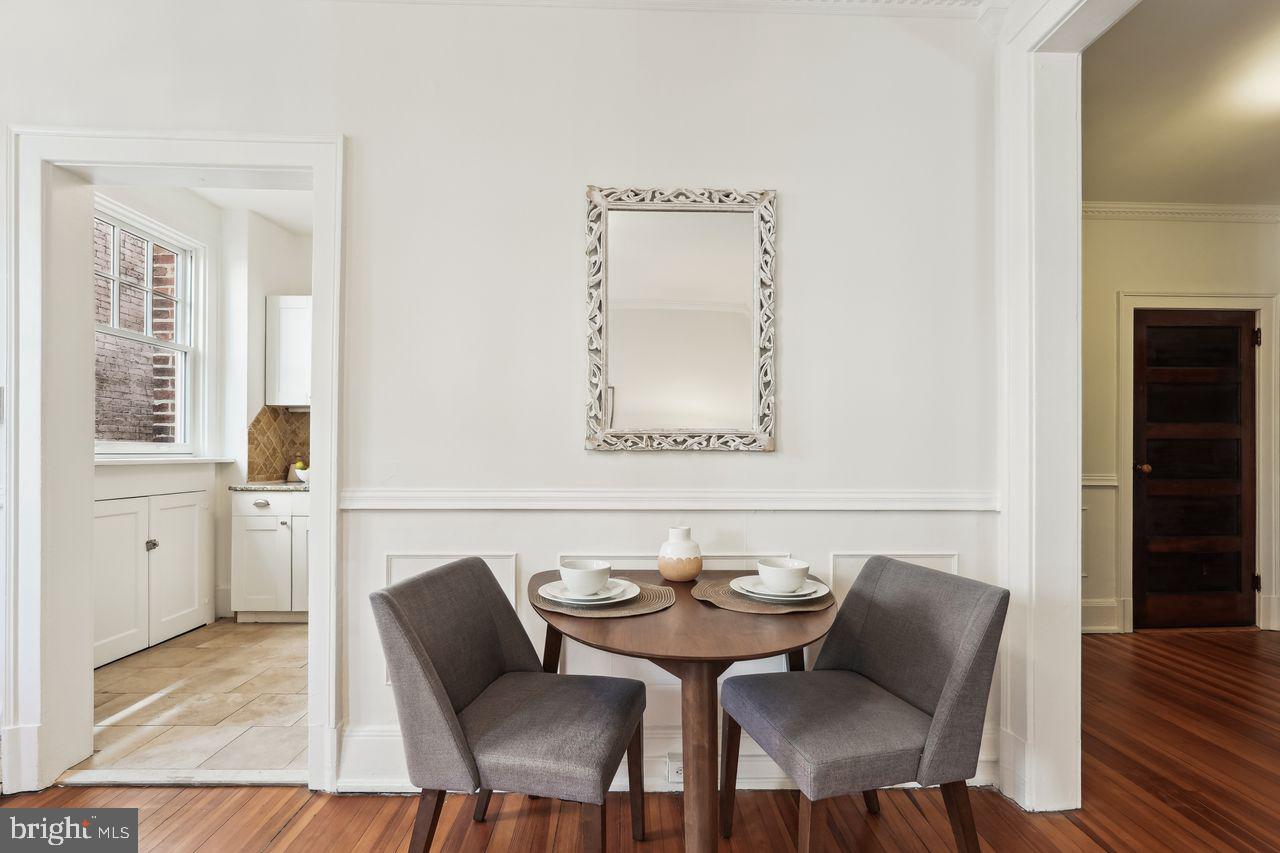 516 A Street Northeast, Unit 205 Washington, DC 20002 - Photo 11 of 24 a view of a dining room with furniture and wooden floor