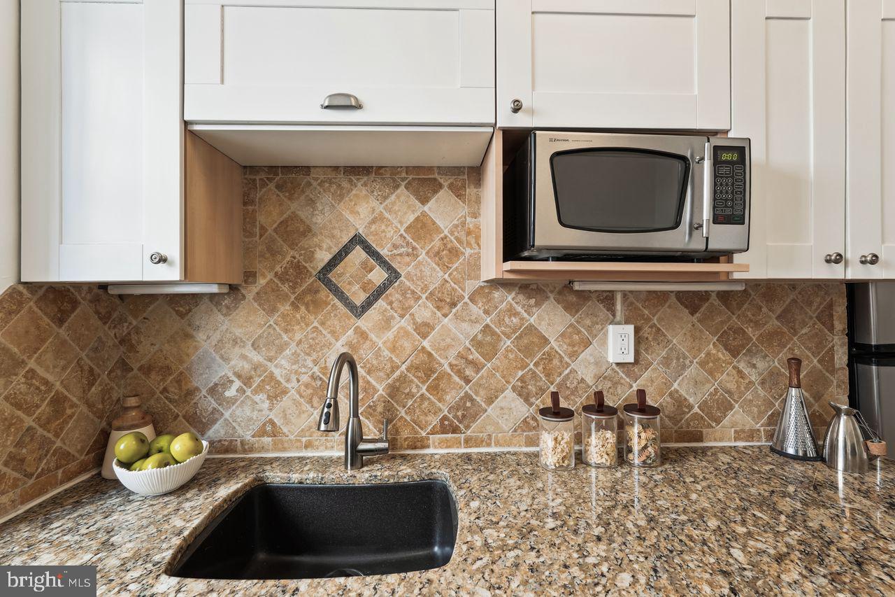 516 A Street Northeast, Unit 205 Washington, DC 20002 - Photo 14 of 24 a kitchen with a stove and a microwave