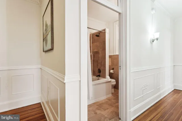 a view of a bathroom from a hallway