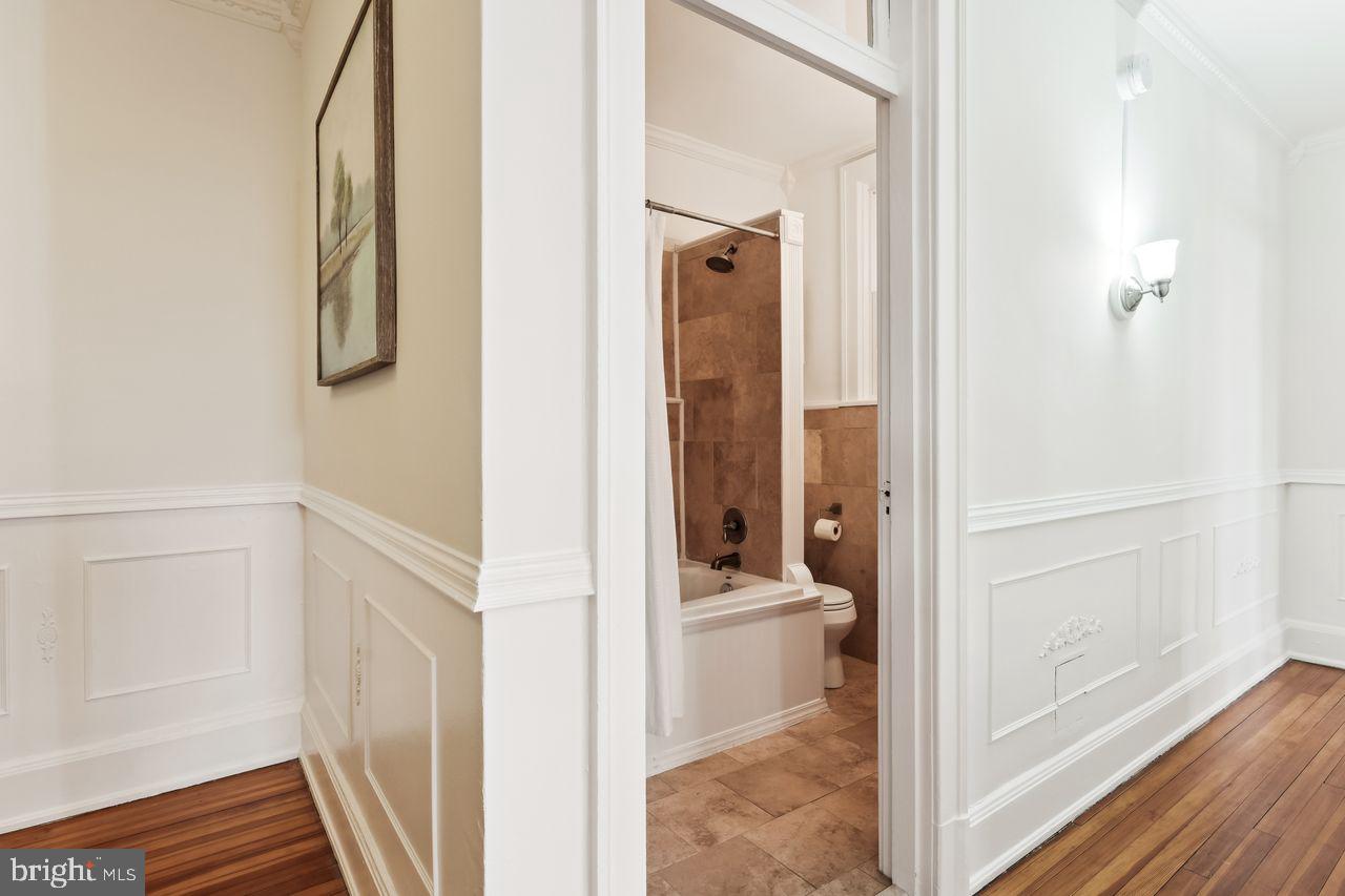 516 A Street Northeast, Unit 205 Washington, DC 20002 - Photo 17 of 24 a view of a bathroom from a hallway