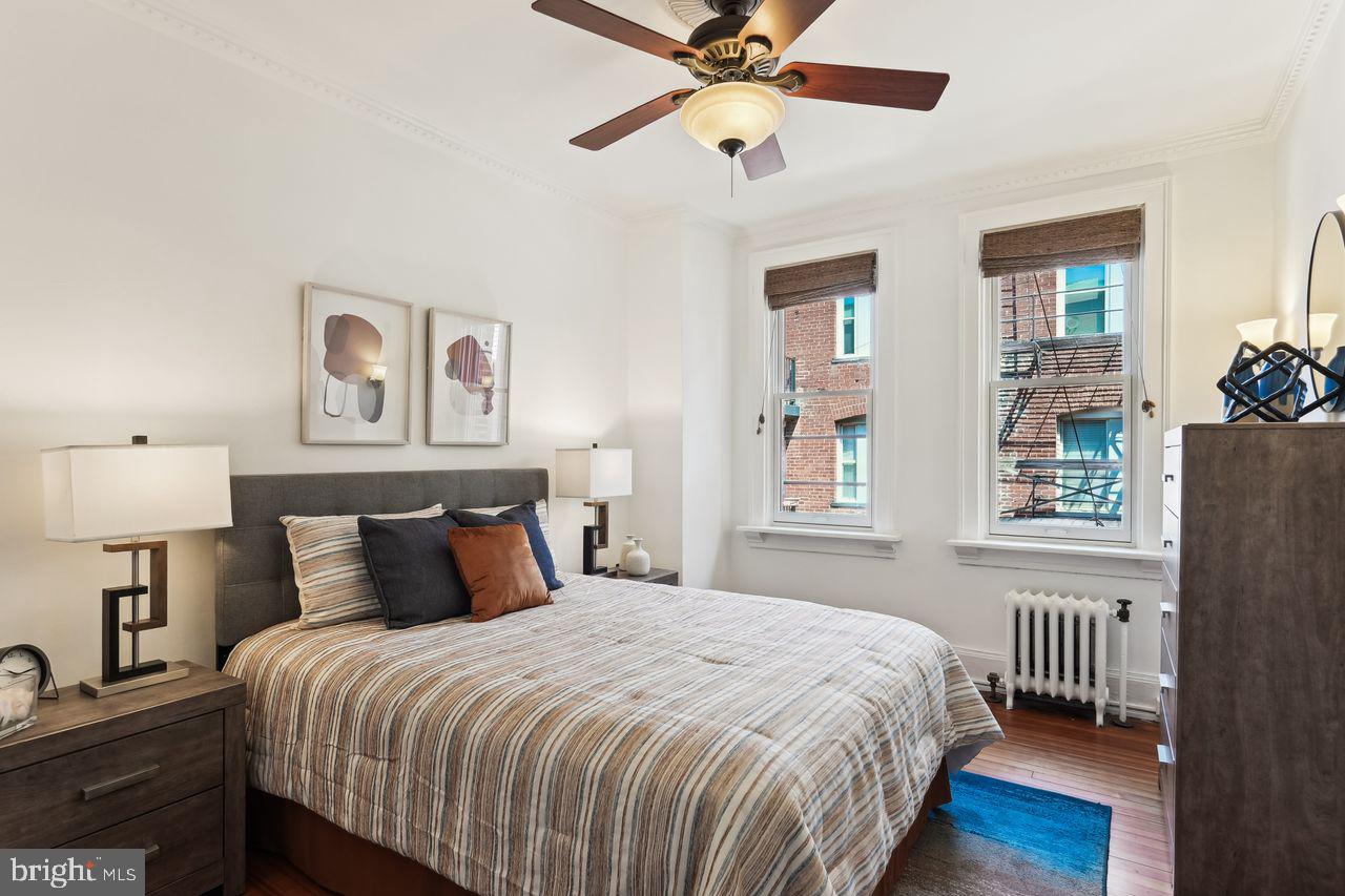 516 A Street Northeast, Unit 205 Washington, DC 20002 - Photo 20 of 24 a bedroom with a bed and a window