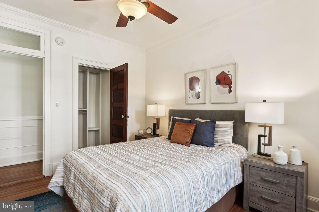 516 A Street Northeast, Unit 205 Washington, DC 20002 - Photo 21 of 24 a bedroom with a bed and lamp