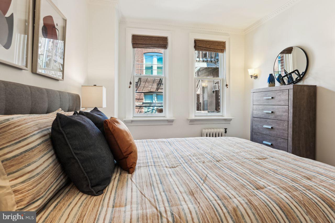 516 A Street Northeast, Unit 205 Washington, DC 20002 - Photo 22 of 24 a bedroom with a bed and a window