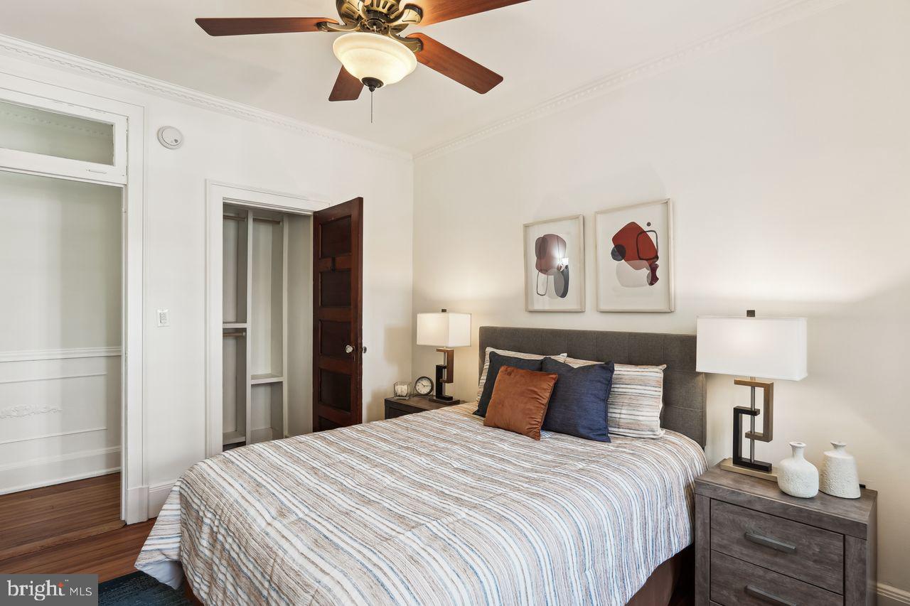 516 A Street Northeast, Unit 205 Washington, DC 20002 - Photo 23 of 24 a bedroom with a bed and lamp