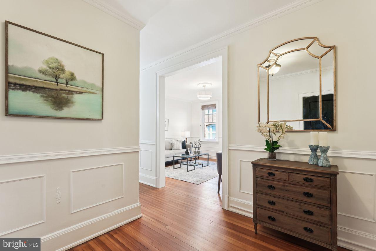516 A Street Northeast, Unit 205 Washington, DC 20002 - Photo 3 of 24 a living room with furniture and wooden floor