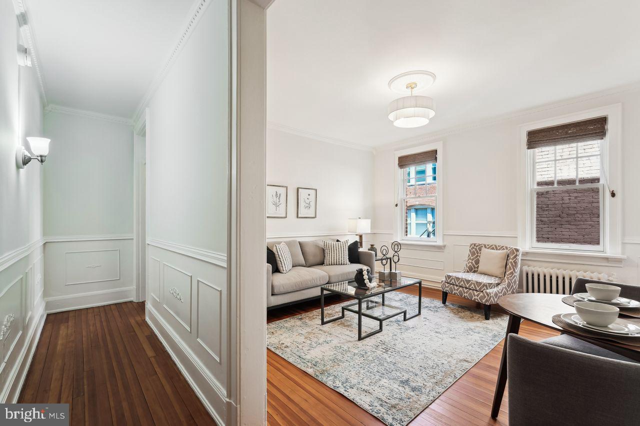 516 A Street Northeast, Unit 205 Washington, DC 20002 - Photo 4 of 24 a living room with furniture and a table