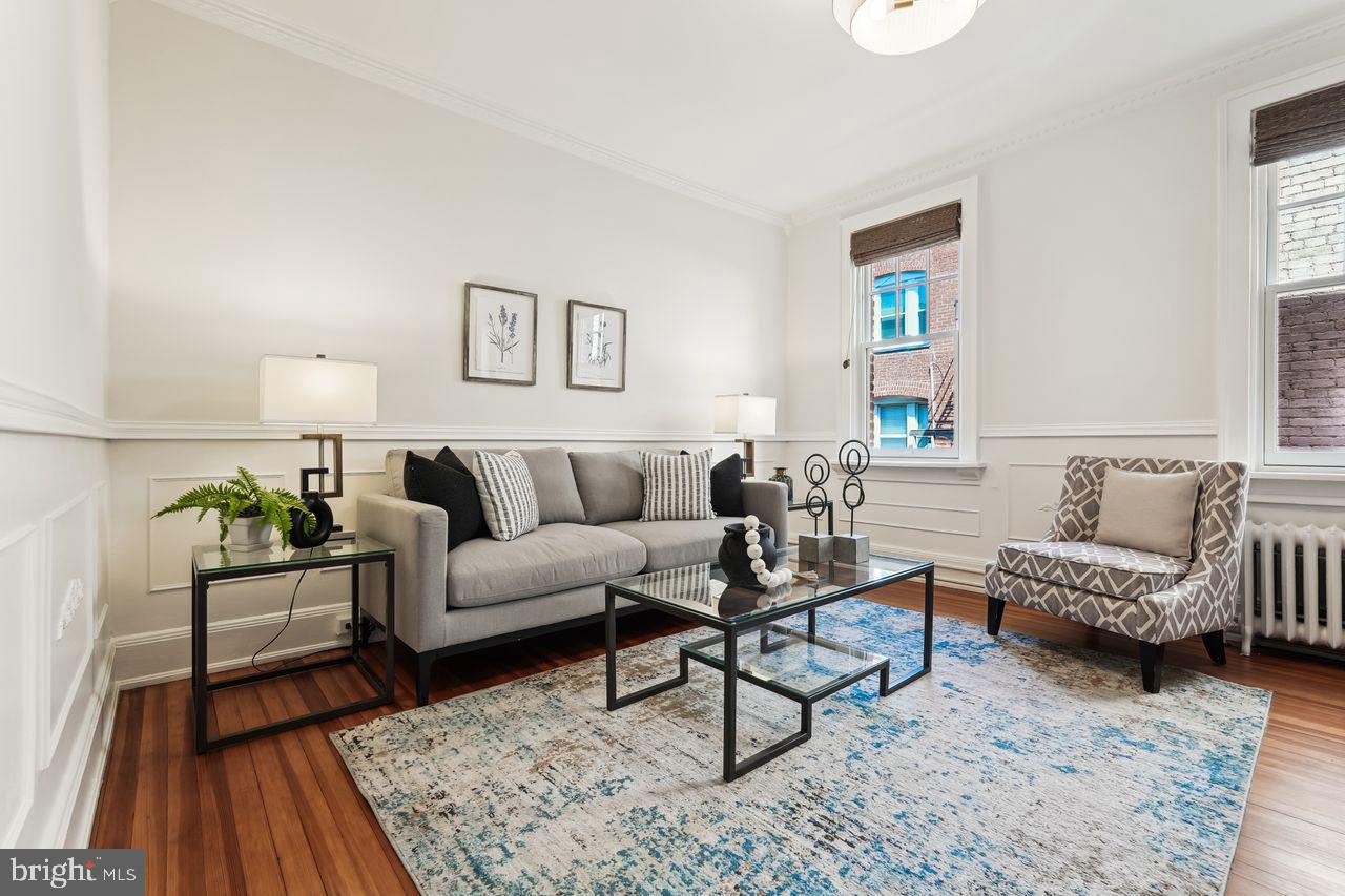 516 A Street Northeast, Unit 205 Washington, DC 20002 - Photo 6 of 24 a living room with furniture and a wooden floor