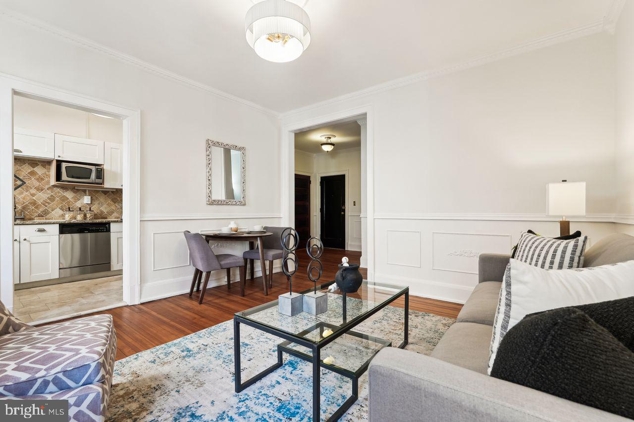 516 A Street Northeast, Unit 205 Washington, DC 20002 - Photo 9 of 24 a living room with furniture and a flat screen tv
