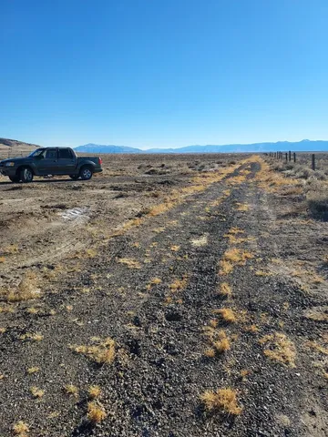 a view of car parked on the side of a road