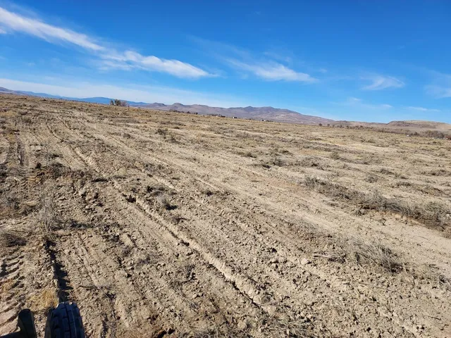a view of a large body of water with a building in the background
