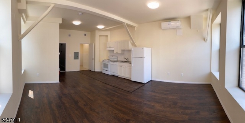 192 Market Street, Unit 7A Newark, NJ 07102 - Photo 3 of 9 a view of kitchen and wooden floor
