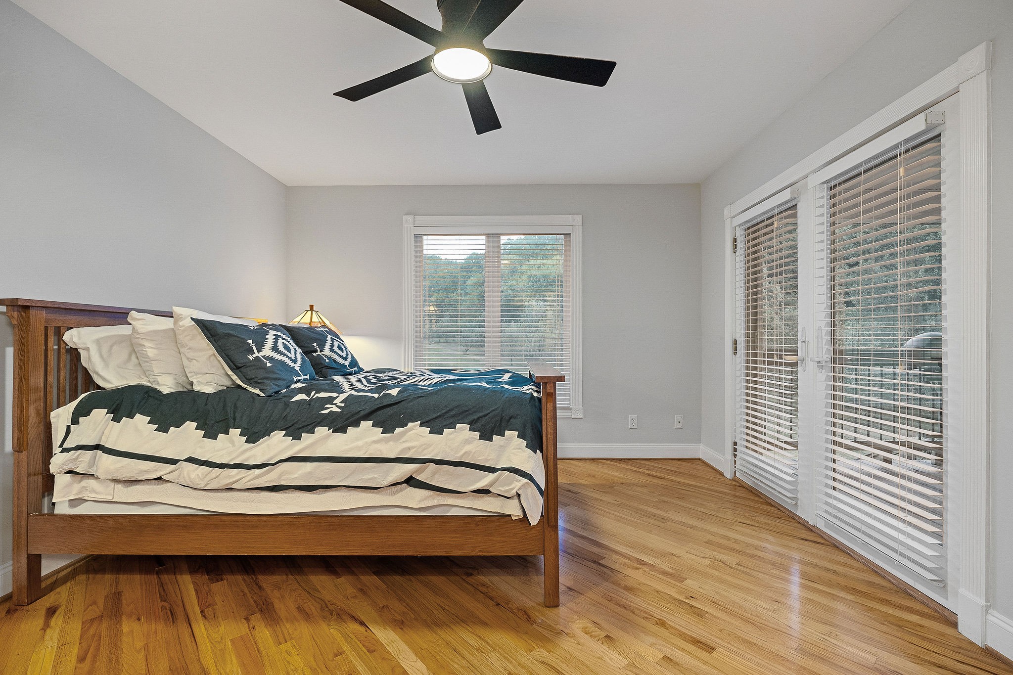 574 Hayes Ridge Road Lancaster, TN 38569 - Photo 11 of 53 a bedroom with a bed and wooden floor