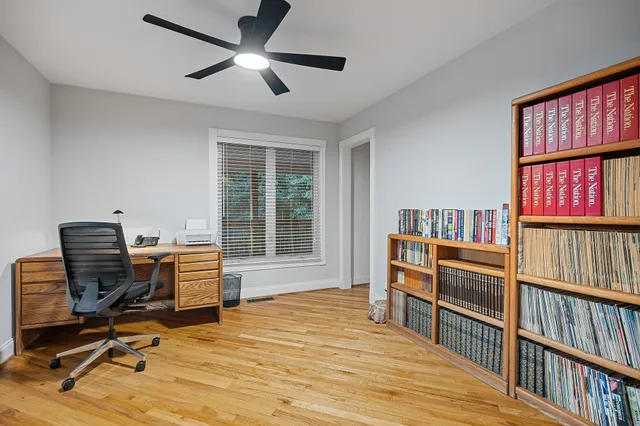 a workspace with furniture hardwood and a window