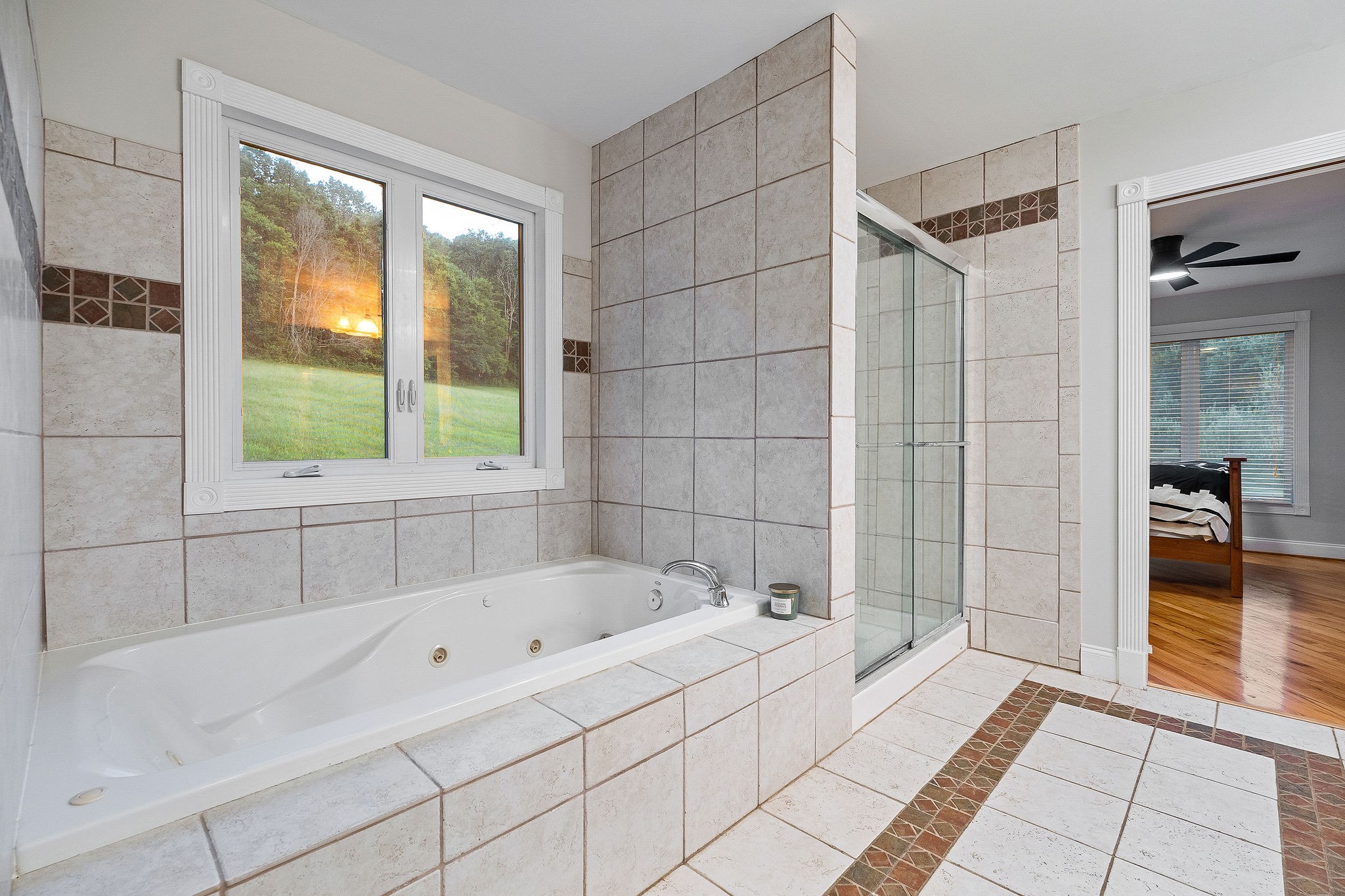 574 Hayes Ridge Road Lancaster, TN 38569 - Photo 23 of 53 a bathroom with a bathtub and a shower