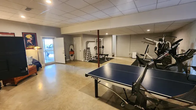 a room with lots of chairs and mirrors