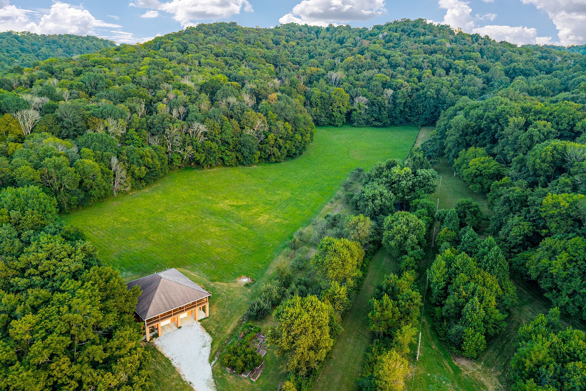 574 Hayes Ridge Road Lancaster, TN 38569 - Photo 39 of 53 a view of a yard with a house