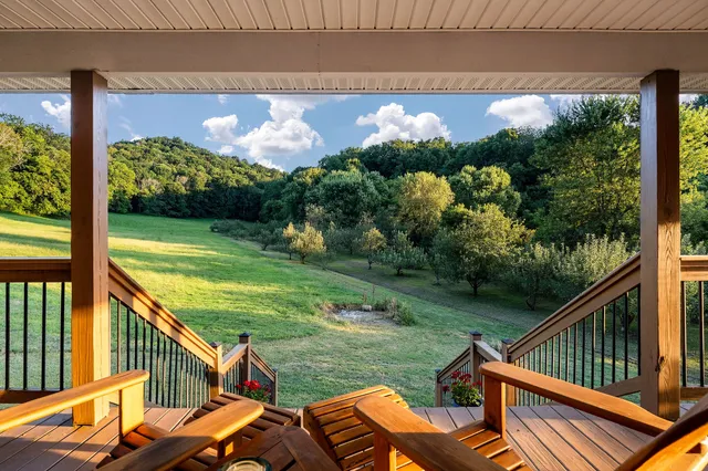 a view of a two chairs on the deck