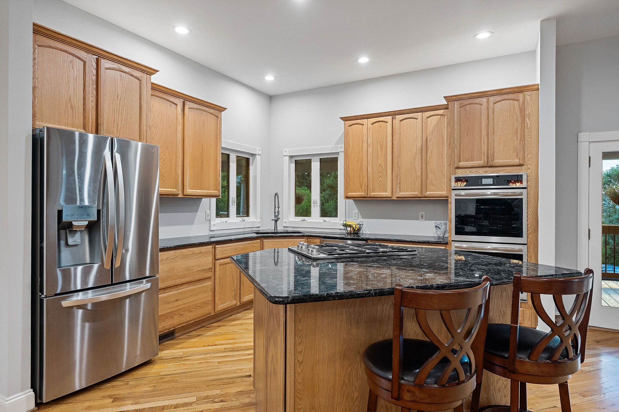 574 Hayes Ridge Road Lancaster, TN 38569 - Photo 10 of 53 a kitchen with stainless steel appliances granite countertop a stove refrigerator sink and cabinets