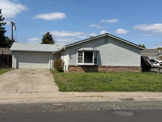 337 Quadra Avenue Rio Linda, CA 95673 - Photo 1 of 27 a front view of a house with a yard