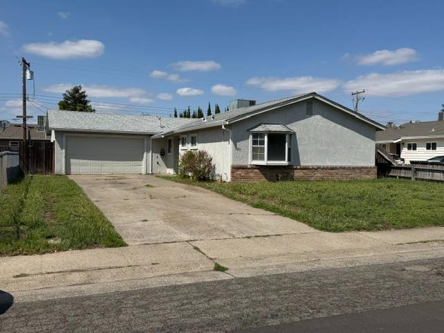 337 Quadra Avenue Rio Linda, CA 95673 - Photo 3 of 27 a front view of a house with a yard and garage
