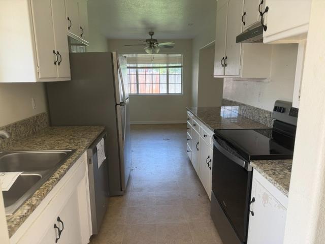 337 Quadra Avenue Rio Linda, CA 95673 - Photo 4 of 27 a kitchen with a sink stove and cabinets