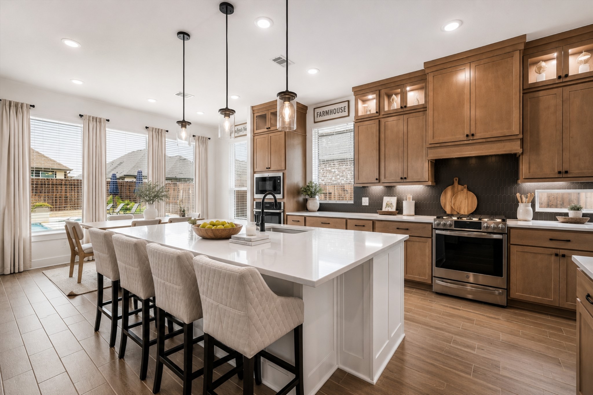 323 Blue River Trail Rosenberg, TX 77471 - Photo 8 of 28 THIS KITCHEN IS A TRUE SHOWSTOPPER - DUAL TONED CABINETRY AND AN EXPANSIVE ISLAND CREATE THE IDEAL SETTING FOR HOME COOKED MEALS OR ENTERTAINING.