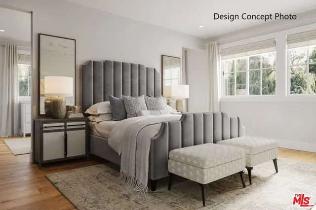 a bedroom with a bed and a couch